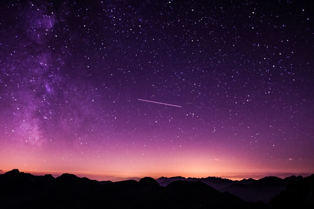 Dawn light over creation landscape — Genesis 1 male and female